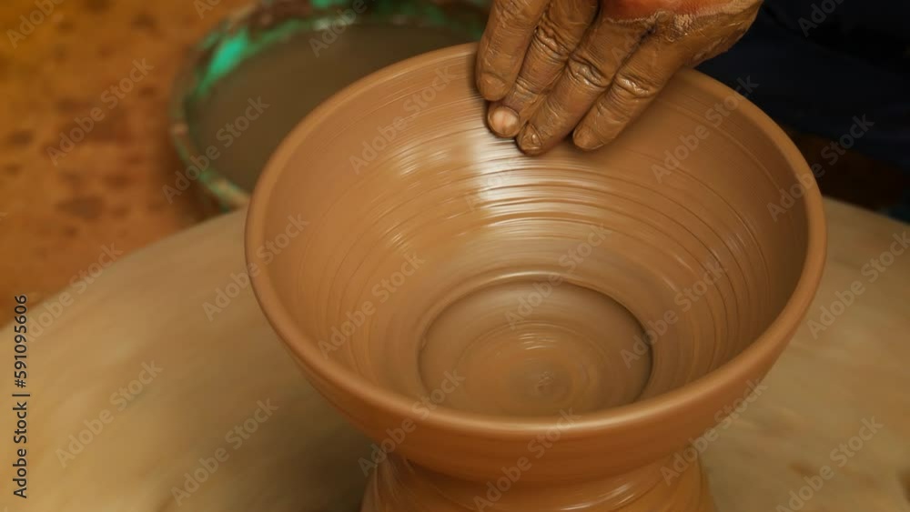 Potter at work makes ceramic dishes. India, Rajasthan.