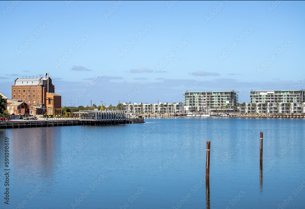 Cityscape with water surface, bay, lake, city houses on the shore