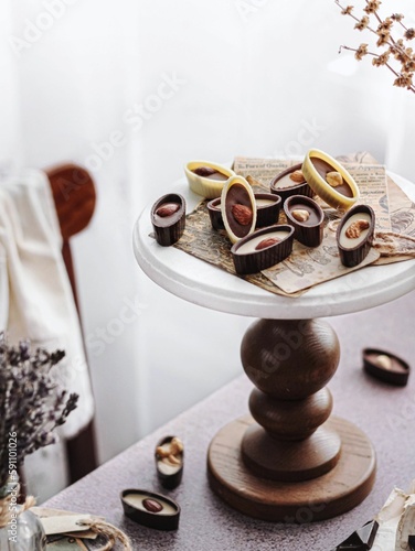 Vertical shot of a decorative stand with chocolate nut sweets