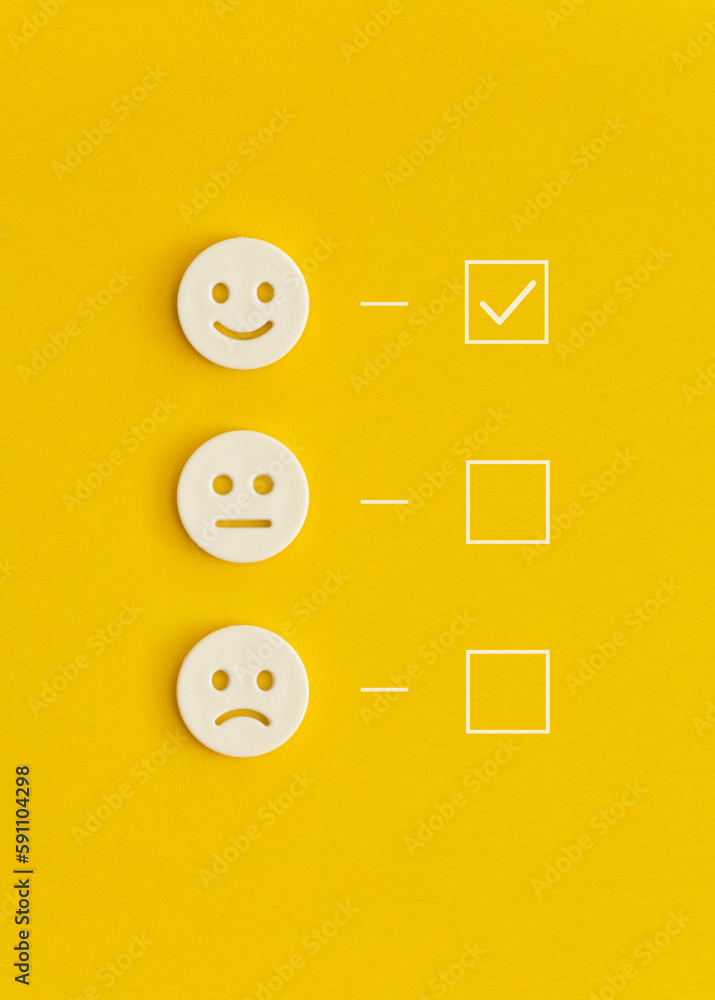 Emoticon smile on a yellow background. Customer feedback.