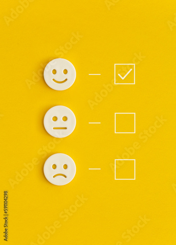 Obraz na płótnie Emoticon smile on a yellow background. Customer feedback. w salonie