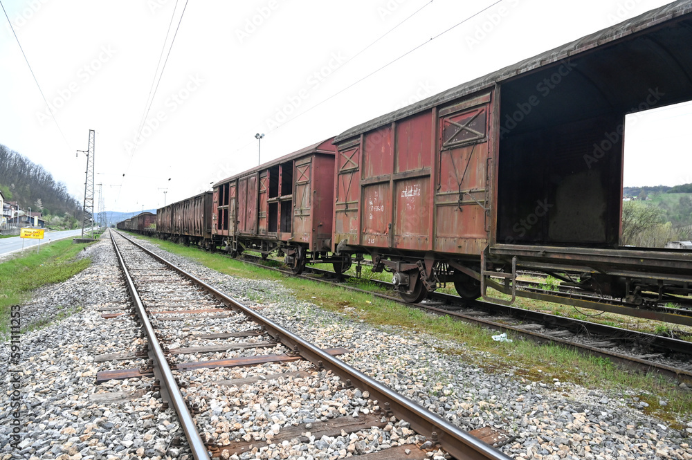 Train on Railway tracks. A freight car at a railway station. Transportation. Goods Wagon. Train on Railway tracks. A freight car at a railway station. Transportation. Goods Wagon.