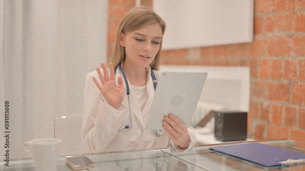 Online Video Chat on Tablet by Female Doctor in Clinic Online Video Chat on Tablet by Female Doctor in Clinic