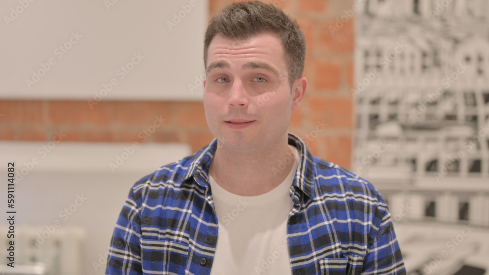 Portrait of Disliking Young Casual Man Rejecting Offer Portrait of Disliking Young Casual Man Rejecting Offer