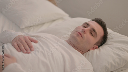 Young Man Waking Up and Leaving Bed
