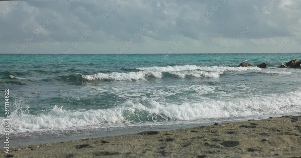 Calm Slow Motion View Of Breaking Waves Along Beach At Varazze. Establishing Shot, Locked Off Calm Slow Motion View Of Breaking Waves Along Beach At Varazze. Establishing Shot, Locked Off