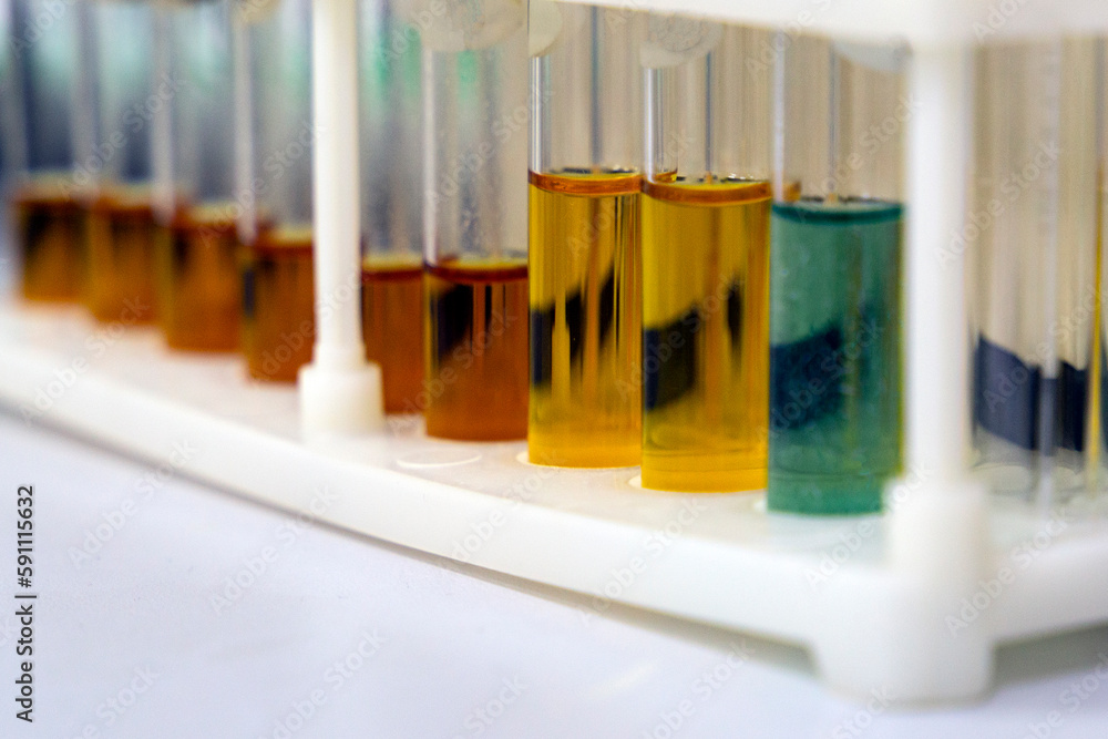 Test tubes with multicolored reagent analysis. Colorimetry experiment