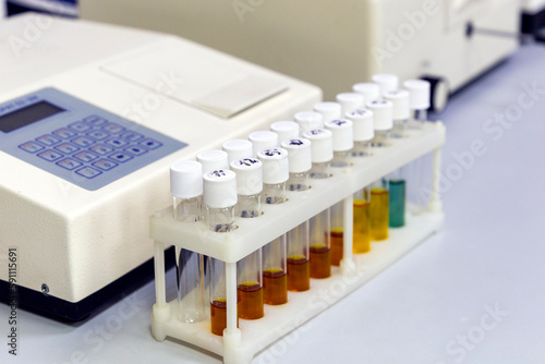 Fototapeta Naklejka Na Ścianę i Meble -  Test tubes with multi-colored reagent analysis. Colorimetry experiment in the laboratory