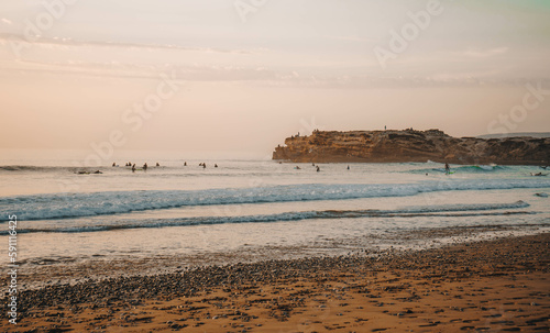 Sunset over Devil's Rock at Surfer Point in Tamraght, Morocco photo