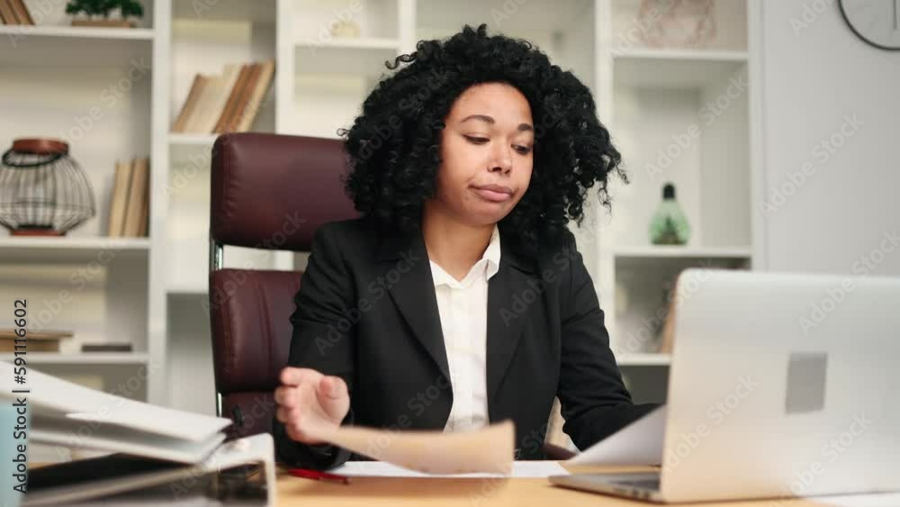 Worried nervous young businesswoman office worker having problems with paper work document at modern office Stressed employee feeling exhausted and looking at camera with sad face at workplace Worried nervous young businesswoman office worker having problems with paper work document at modern office Stressed employee feeling exhausted and looking at camera with sad face at workplace