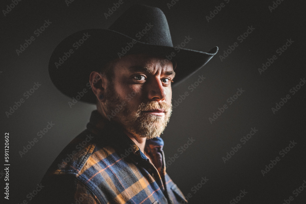 Rugged man in cowboy hat. Studio session. Rugged man in cowboy hat. Studio session.