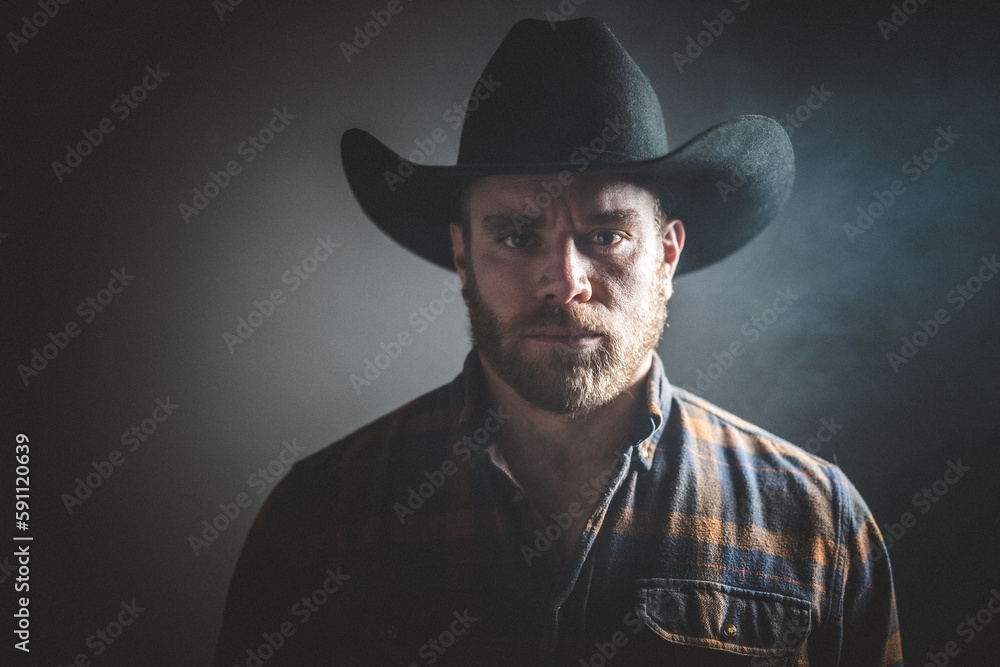 Rugged man in cowboy hat. Studio session. Rugged man in cowboy hat. Studio session.
