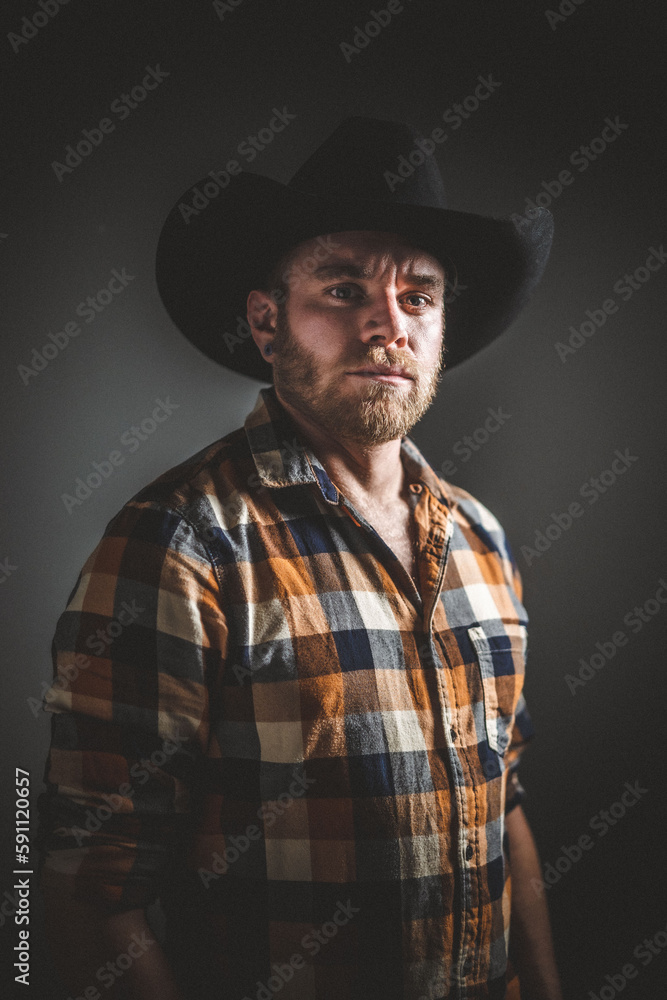 Rugged man in cowboy hat. Studio session. Rugged man in cowboy hat. Studio session.