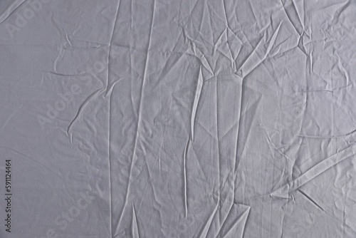 Crumpled grey fabric as background  top view
