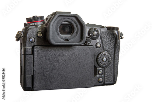 Japanese professional mirrorless digital camera in Micro Four Thirds format. Back view. Isolated on white background. photo