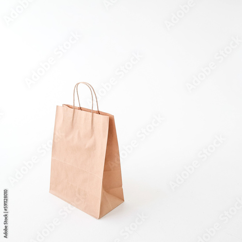 The craft package is on a white background. Space for text and logo. The concept of delivery, food, packaging, gift.