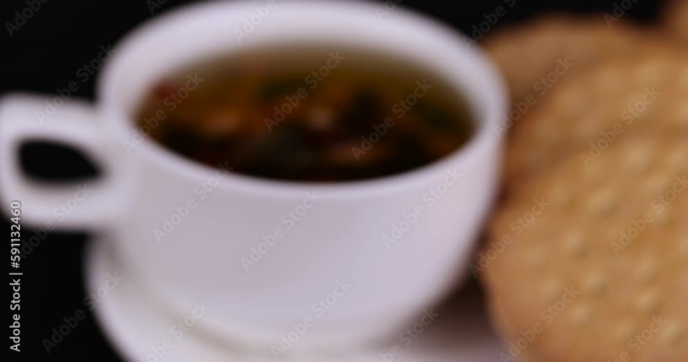crispy cookies with chocolate filling between cookies, fresh crispy cookie sandwich and tea