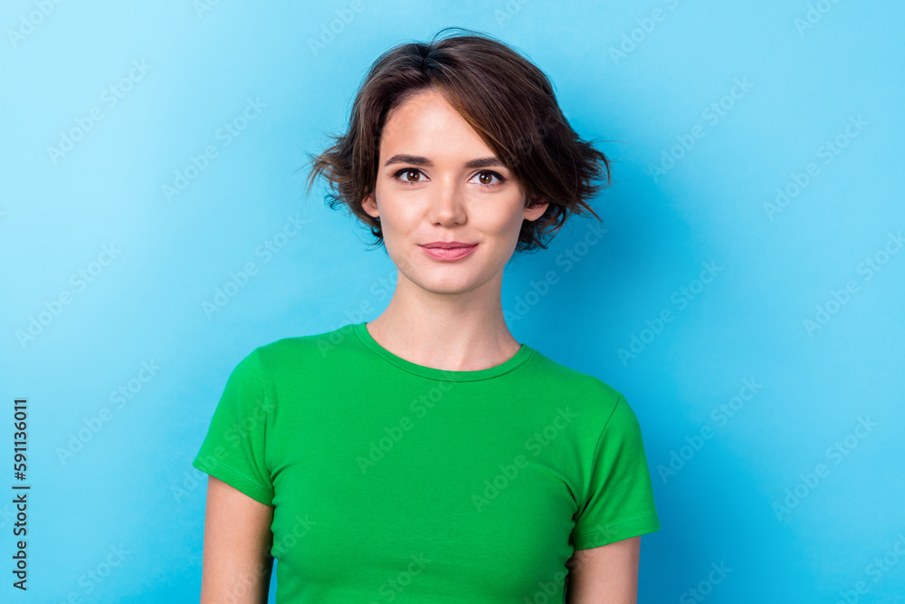 Photo of charming good mood lady dressed green top smiling isolated blue color background Photo of charming good mood lady dressed green top smiling isolated blue color background