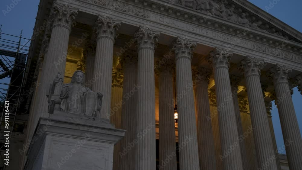 Night time trucking view to right showing sculpture the facade of the Supreme Court building and focus on the Three Fates with light behind. Night time trucking view to right showing sculpture the facade of the Supreme Court building and focus on the Three Fates with light behind.