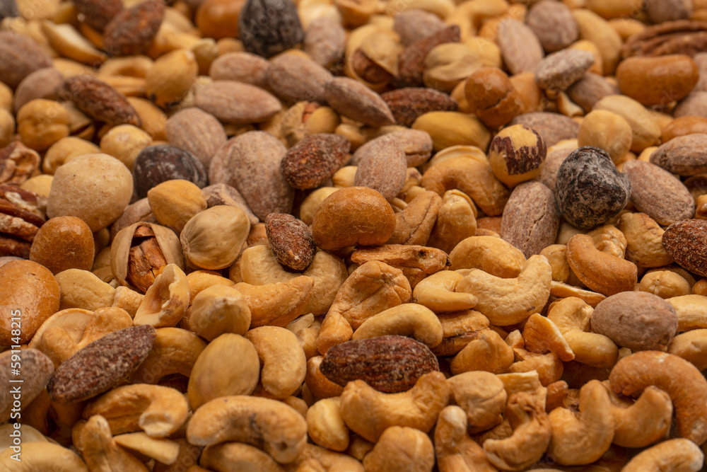 A group of almonds, pistachios, walnuts, macadamia, cashews. A group of almonds, pistachios, walnuts, macadamia, cashews.