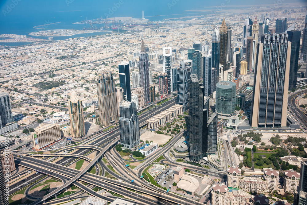 Fototapeta premium Dubai skyline on sunset, modern city with skyscrapers