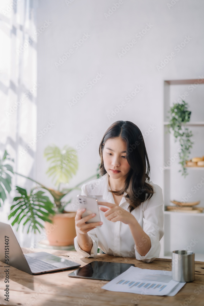 Hand using smart phone, mobile p payments online shopping, omni channel, digital tablet docking keyboard computer. Hand using smart phone, mobile p payments online shopping, omni channel, digital tablet docking keyboard computer.