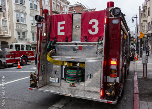 Obraz na płótnie San Francisco, California, USA, June 29, 2022: The San Francisco Fire Station 3 at Post Street, Firefighters' truck parked on the road. w salonie