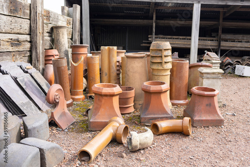 Chimney pots in a salvage yard photo