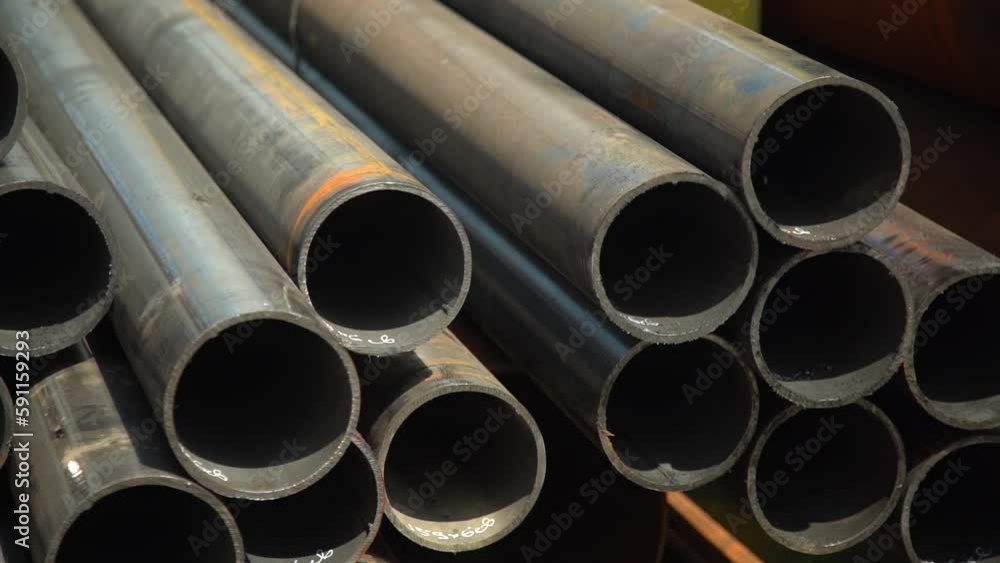 Stainless steel pipes lie in the finished product warehouse at the rolled steel mill Stainless steel pipes lie in the finished product warehouse at the rolled steel mill