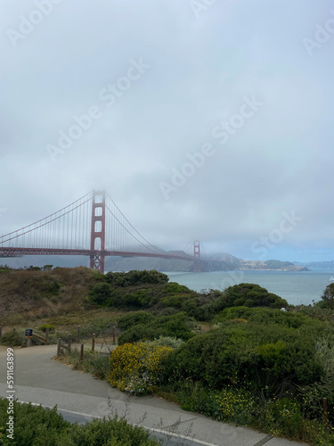San Francisco, California, USA, June 29, 2022: The Golden Gate Bridge from the Battery East Vista overlook at Presidio of San Francisco. © An Instant of Time