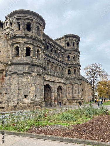 Trier, Germany, November 27, 2022: The Porta Nigra, the emblem of Trier (Germany's oldest city), is the best-preserved Roman city gate north of the Alps. The city gate was built around 170 CE.
