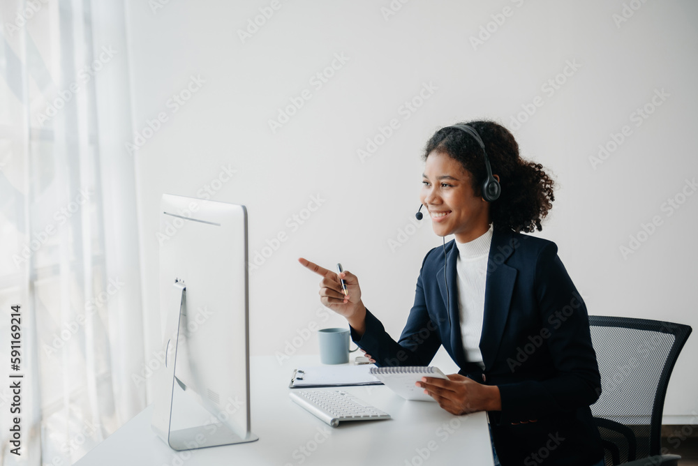 Serious call center operator in wireless headset talking with customer, woman in headphones with microphone consulting client on phone in customer support service Serious call center operator in wireless headset talking with customer, woman in headphones with microphone consulting client on phone in customer support service