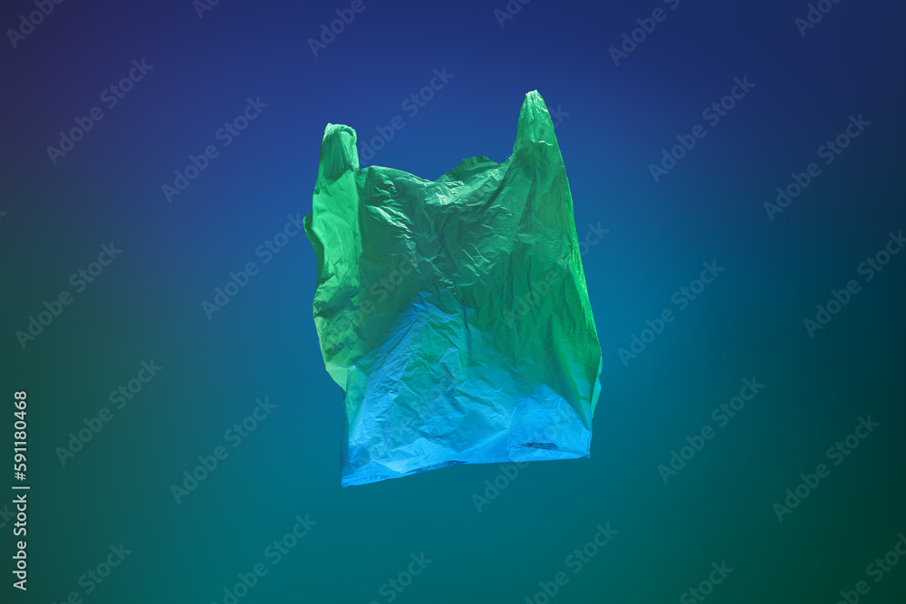 Obraz premium colored plastic green and blue bag on green and blue sea background