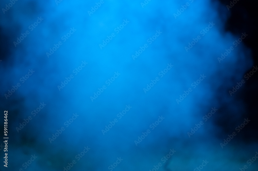 A foggy blue cloud of smoke at night