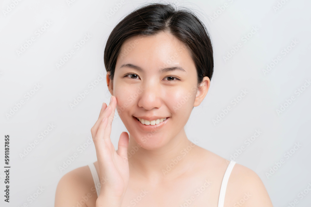 Asian woman showing clear, moisturized, healthy looking skin with make-up on her face. Asian woman showing clear, moisturized, healthy looking skin with make-up on her face.