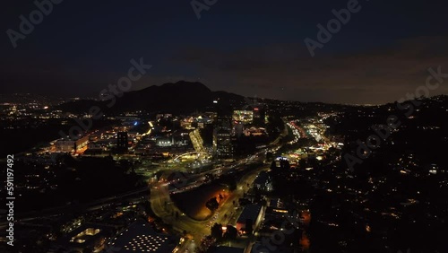 Wallpaper Mural Forwards fly above evening city. Busy transport infrastructure leading through Studio City district. Los Angeles, California, USA Torontodigital.ca