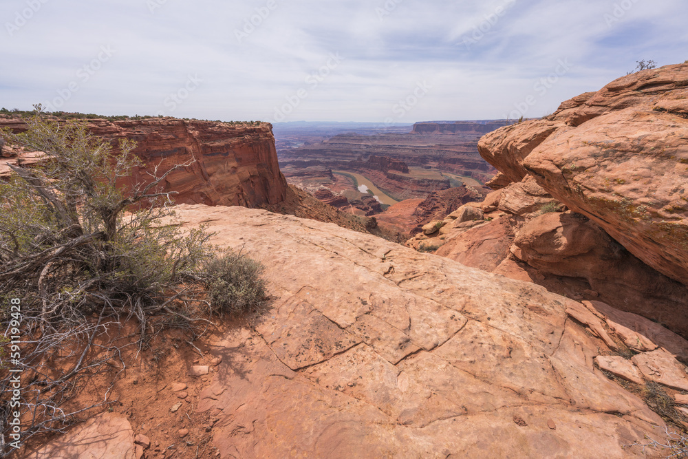 hiking the dead horse trail in dead horse point state park in utah, usa hiking the dead horse trail in dead horse point state park in utah, usa