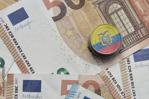 euro coin with national flag of ecuador on the euro money banknotes background