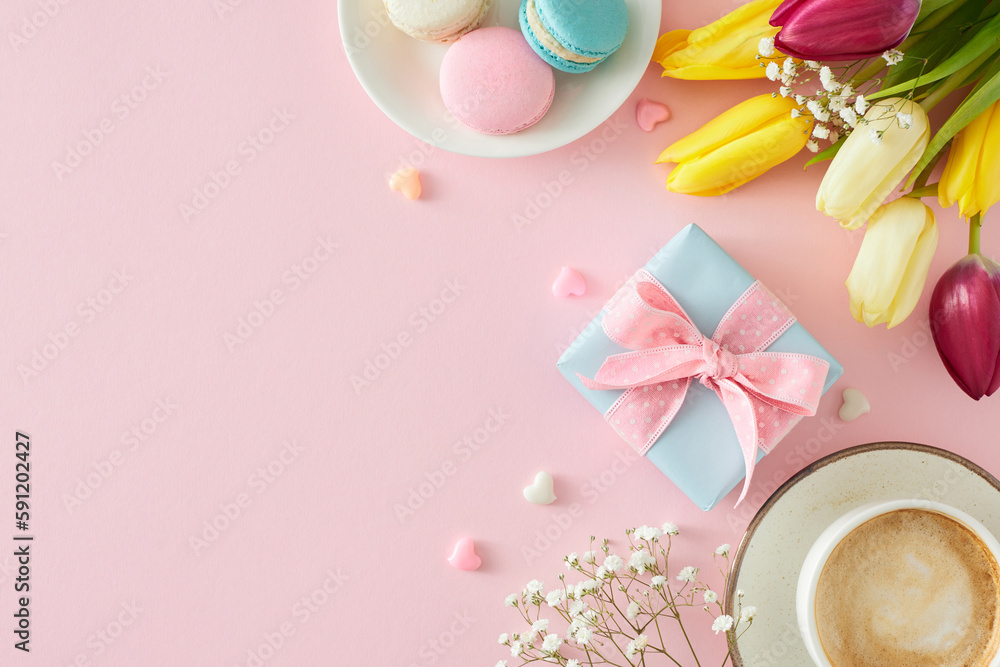 Mother's Day celebration concept. Top view photo of gift box cup of coffee macaroons small hearts bunch of colorful tulips and gypsophila flowers on pastel pink background with copyspace
