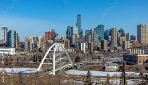 Obraz na plátně Skyline of Downtown Edmonton with the Walterdale Bridge in the view in the morning with blue sky during winter