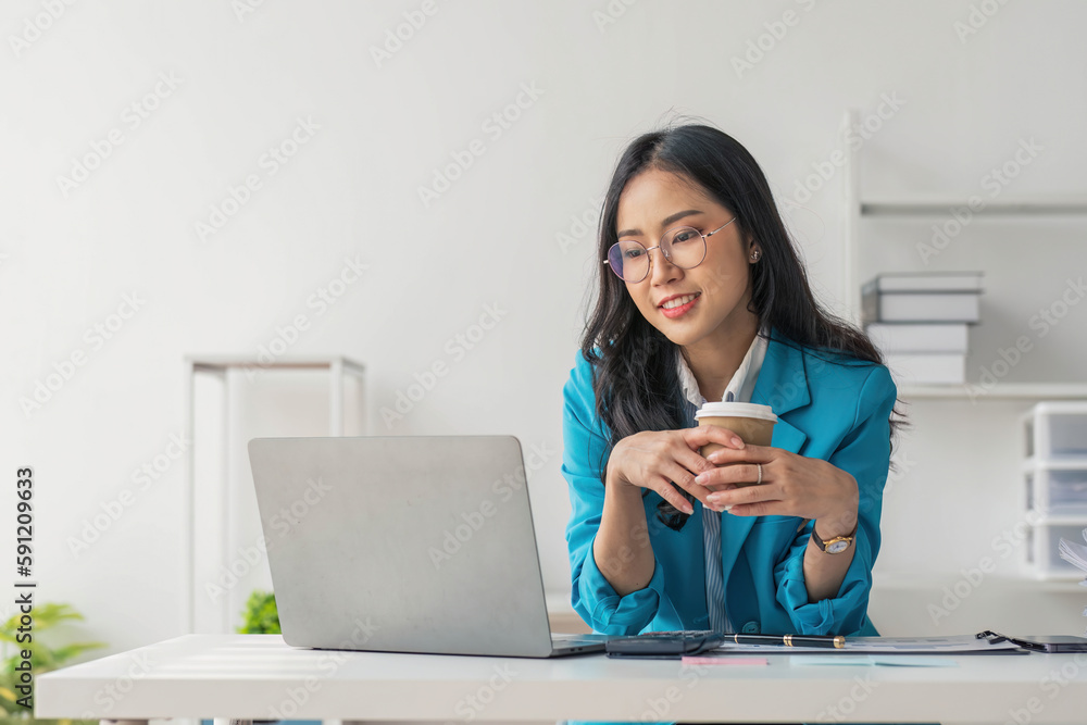 Business woman using calculator for do math finance on wooden desk in office and business working background, tax, accounting, statistics and analytic research concept.. Business woman using calculator for do math finance on wooden desk in office and business working background, tax, accounting, statistics and analytic research concept..