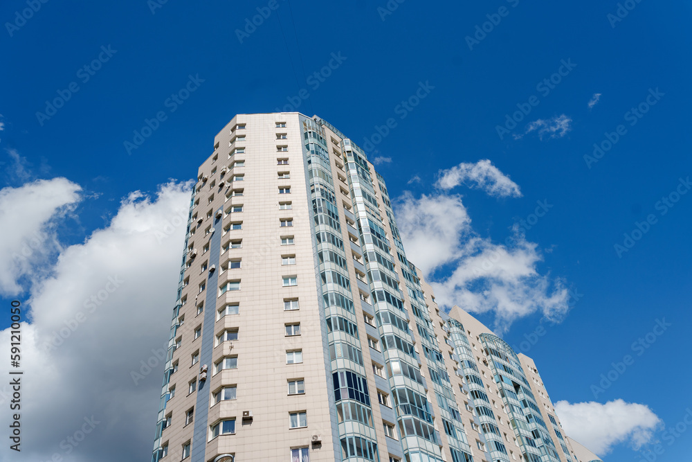 Fototapeta premium Multi-storey apartment building with many windows