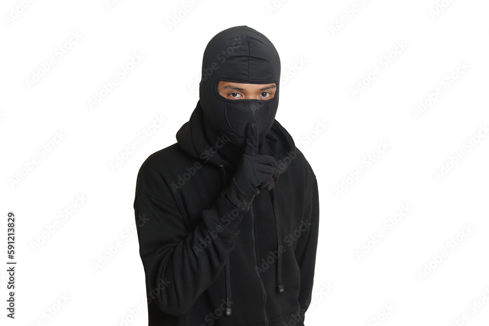 Mysterious man wearing black hoodie standing and looking at camera. Isolated image on gray background