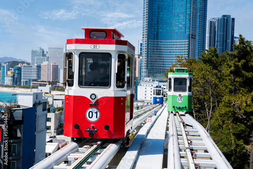 Colorful Sky Capsule train, a landmark seaside railway route, a destination where tourists take a scenic train ride along the seaside in Busan, Korea. photo