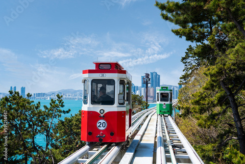 Photography Colorful Sky Capsule train, a landmark seaside railway route, a destination where tourists take a train by the sea in Busan, Korea