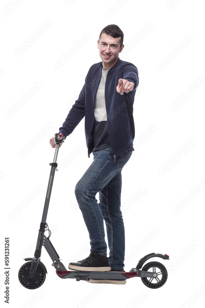 smiling young man with an electric scooter . smiling young man with an electric scooter .