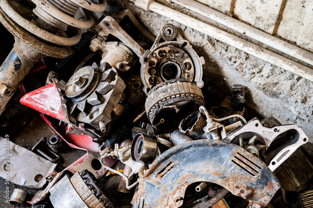 Close-up of removed old car parts in a car service. Close-up of removed old car parts in a car service.