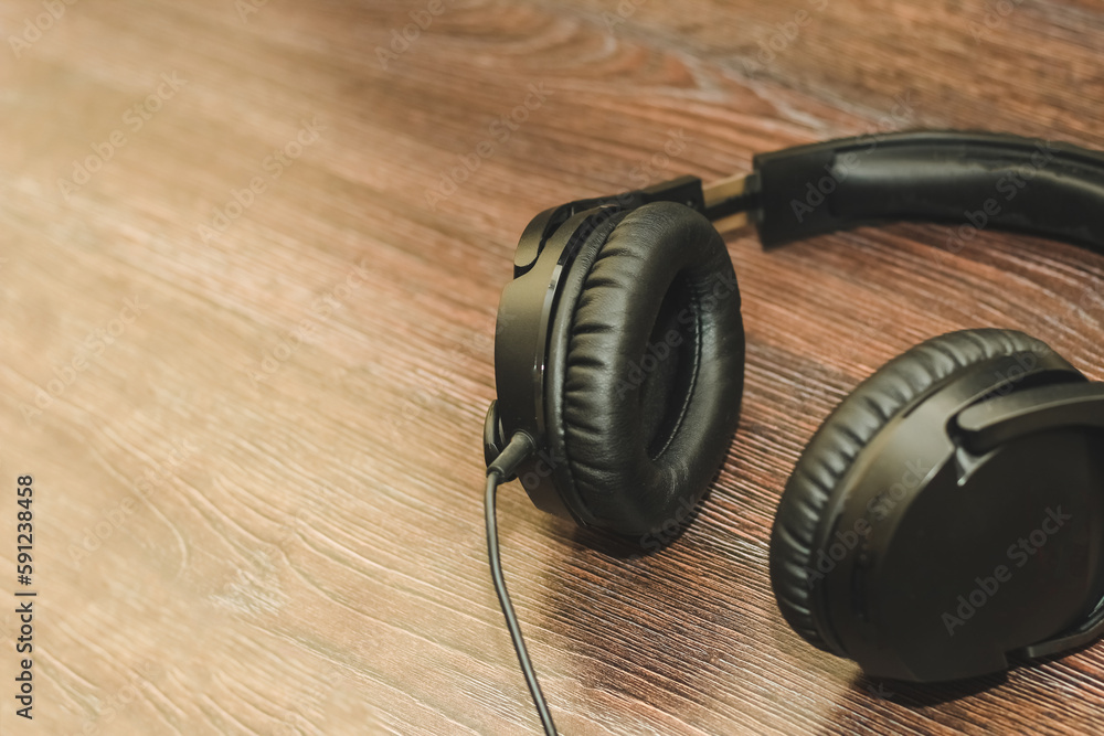 Gaming headphones with a microphone headset on the table. Gaming headphones with a microphone headset on the table.