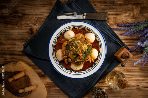 Dumplings with turkey and chorizo sauce. photo