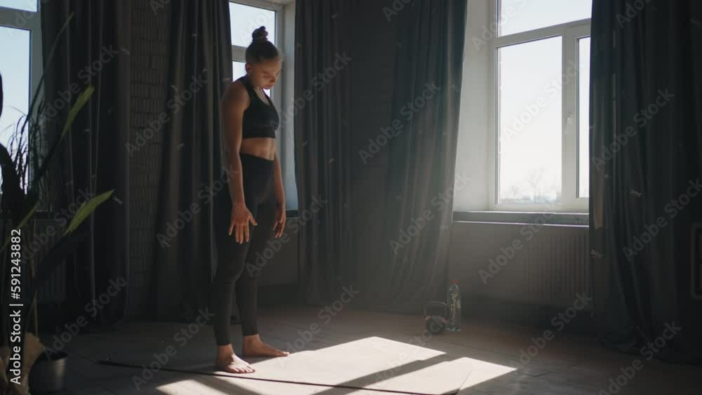 Athletic Woman Doing Exercise And Gymnastics For Neck At Home, Rotating Head And Warming Muscles Athletic Woman Doing Exercise And Gymnastics For Neck At Home, Rotating Head And Warming Muscles